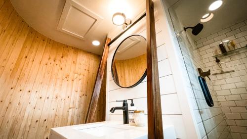 Bathroom-Curved-Plank-Wall-White-Shiplap-Custom-Leaning-Vanity-Black-Finishes-White-Subway-Tile-Dark-Grout-Glass-Shower-Door-Cherokee (1)