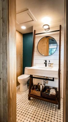 Bathroom-White-Shiplap-Custom-Leaning-Vanity-Teal-Accent-Wall-Black-Finishes-Mosaic-Floor-Tile-Cherokee
