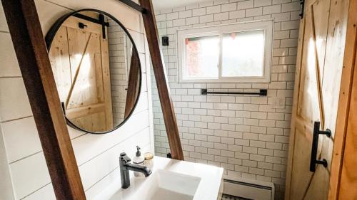 Bathroom-Wood-Barn-Door-White-Subway-Tile-Black-Finishes-Dark-Grout-Custom-Leaning-Vanity-White-Shiplap-Cherokee
