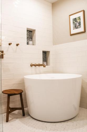 Master-Bathroom-Japanese-Soaking-Tub-Cream-Wavy-Subway-Tile-Wall-Alcove-White-Hexagon-Floor-Tile-Light-Grout (1)